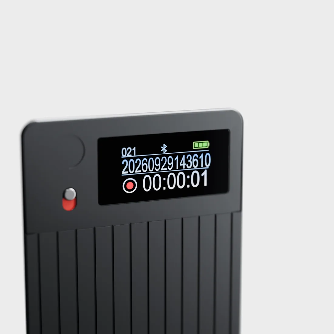 The recorder on its own, its display showing a running recording timer